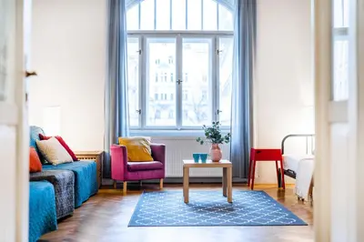 a living room with a couch and a table at 2BDR Old Town Square Apartments w Fast Wi-Fi in Prague