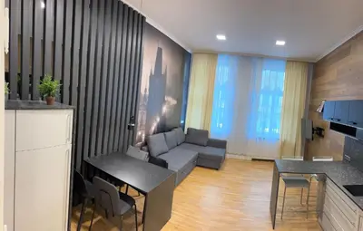 a living room with a couch and a table at Holec Apartments in Prague