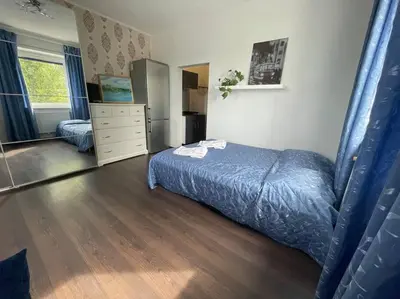 a bedroom with a bed and a dresser in it at Báječné ubytování ve vile s bazénem a terasou v praze in Prague