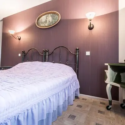 a bedroom with a bed and a painting on the wall at Vila u Prahy,v prirode,jezero Lhota in Lhota