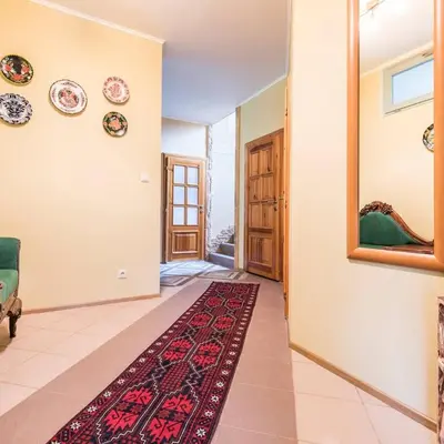 a hallway with plates on the wall and a rug at Vila u Prahy,v prirode,jezero Lhota in Lhota