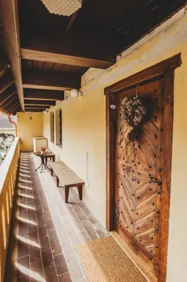 a room with a bench and a wooden door at Boutique Apartmán Speicher in Prague