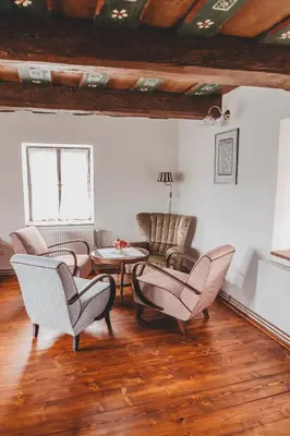 a living room with chairs and a table at Boutique Apartmán Speicher in Prague