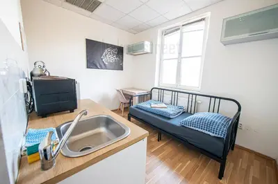 a kitchen with a sink and a bunk bed at Snug room close to metro Palmovka in Prague