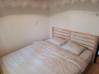 a bedroom with a bed with two pillows on it at Slapy chata Županovice in Županovice
