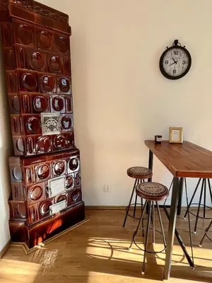 a room with a table and a clock on the wall at TOP lokalita u Pražského hradu! in Prague
