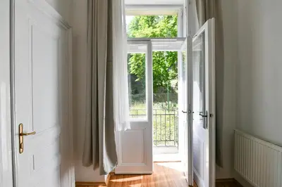 an open door with a window in a room at WSP Petrin Garden Apartments in Prague