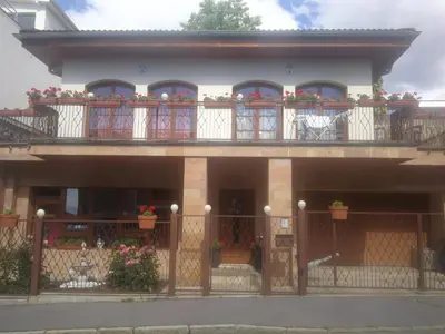 a house with flowers on the balconies of it at Vila Barrandov in Prague