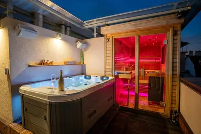 a large bathroom with a tub with a red light at Luxury rooftop appartment with fantastic views in Prague