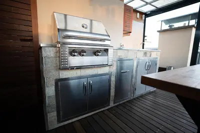 a kitchen with a sink and a counter top at Luxury rooftop appartment with fantastic views in Prague