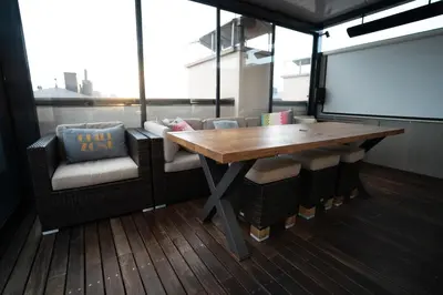 a bedroom with a large white bed with blue pillows at Luxury rooftop appartment with fantastic views in Prague