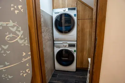 a washer and dryer in a small room at Luxury rooftop appartment with fantastic views in Prague