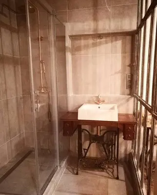 a bathroom with a sink and a shower at Artistic apartment with a balcony in Prague
