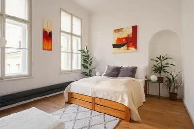 a living room with a couch and chairs and a table at Prague Days - Spacious City Center Studios next to the Powder Tower in Prague