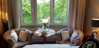 two chairs and a table in front of a window at Solitaire in Poděbrady