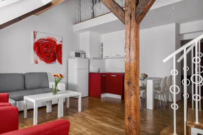 a living room with a couch and a table at Residence Vocelova in Prague
