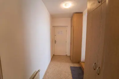 a hallway with a white wall and a white door at FREE PARKING- Cozy apartment in historical building center Prague in Prague