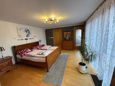 a bedroom with a bed with red pillows at Vila Berlin in Prague