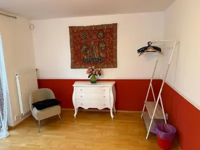 a room with a white dresser and a painting on the wall at Vila Berlin in Prague