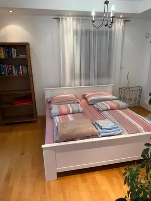 a bed with pillows on it in a bedroom at Vila Berlin in Prague