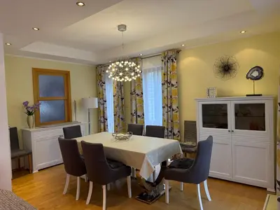 a dining room with a table and chairs at Vila Berlin in Prague