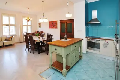 a kitchen with a table and a dining room at Prague OLD TOWN Cozy Luxury Apartman in Heart of City in Prague