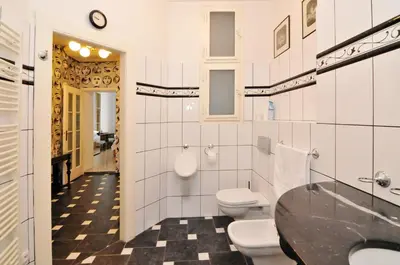 a bathroom with a sink and a toilet and a counter at Prague OLD TOWN Cozy Luxury Apartman in Heart of City in Prague