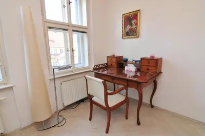 a wooden desk with a chair in a room at Prague OLD TOWN Cozy Luxury Apartman in Heart of City in Prague