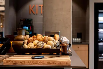a bunch of pastries on a counter in a bakery at Zleep Hotel Prague in Prague