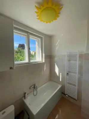 a small bathroom with a sink and a toilet at Dům Na Polabí in Mělník