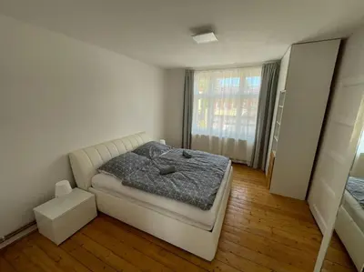a small bedroom with a bed and a window at Dům Na Polabí in Mělník