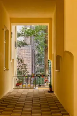 a living room with a couch and a table at TurnKey I Charles Square Apartments in Prague