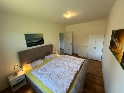a bedroom with a large bed in a room at Chalupa Měňany - Karlštejn in Beroun