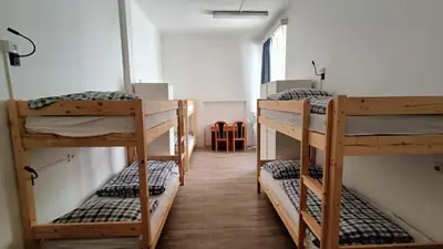 a room with three bunk beds in a room at A Plus Hostel - Centrum in Prague