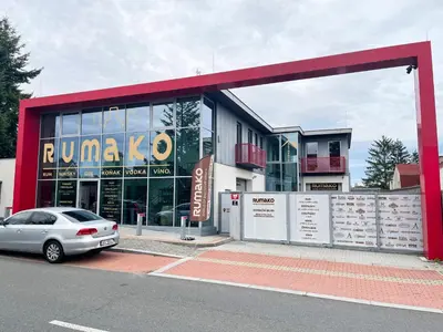 a car parked in front of a building at RUMAKO apartments in Prague