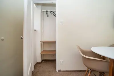a room with a door and a table and a chair at Modern, bright studio in a great location in Prague