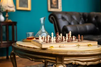 a chess board on a table in a living room at Chateau Charme - Prague centre in Prague
