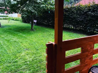 a view of a yard from a wooden fence at Chatka Jägerhaus K myslivně 26 in Libochovice