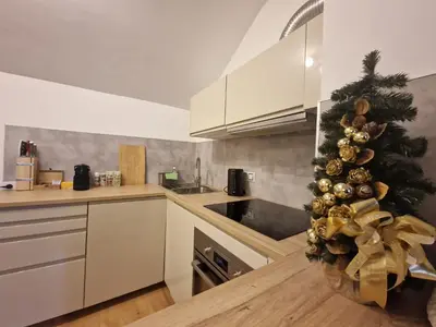 a kitchen with a christmas tree on the counter at Cozy Apt Near Prague Castle in Prague