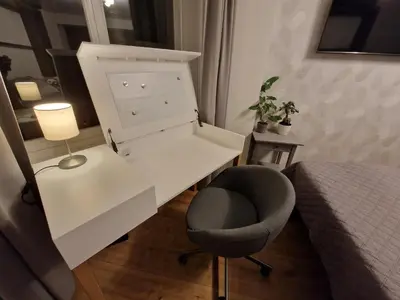 a bedroom with a desk and a chair and a bed at Cozy Apt Near Prague Castle in Prague