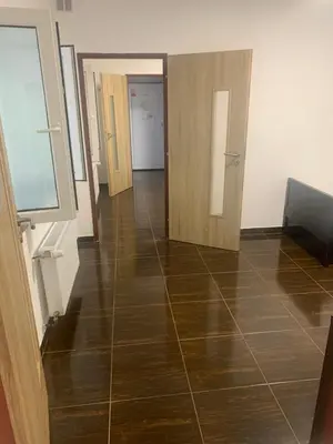 a hallway with two doors and a tile floor at 3 Apartments in 1 location in Prague