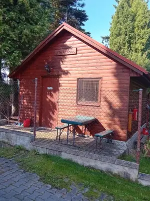 a cabin with a picnic table in front of it at Apartmánová chata Martina in Hradištko