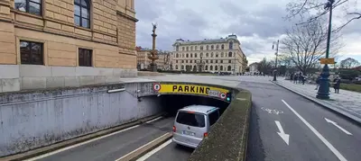 a van driving through a tunnel in a city at Beautiful & peaceful apartment with cute balcony in Prague
