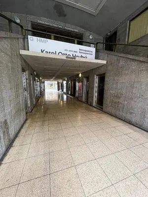 an empty hallway of a building with a sign above it at Vantisch Studio in Prague