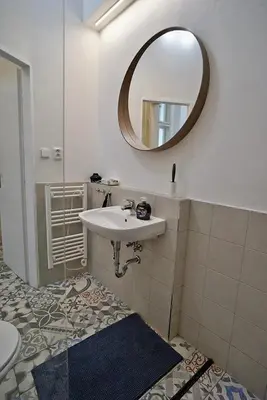 a bathroom with a sink and a mirror at TRUHLÁŘSKÁ 4 APARTMENT in Prague
