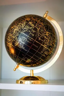 a globe sitting on top of a shelf at Emperors Elegance Suite in Prague