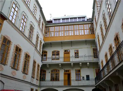 an apartment building with balconies and a balcony at Ruterra Apartment Charles Bridge in Prague