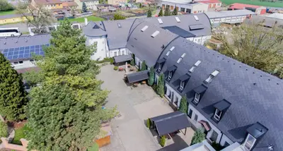 an overhead view of a house with roofs at Hotel Koliba in Litoměřice