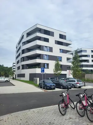 three bikes parked on a sidewalk in front of a building at New apartment in Karlín, Praha 8, close to center in Prague
