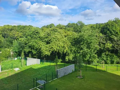 a park with a playground with trees in the background at New apartment in Karlín, Praha 8, close to center in Prague